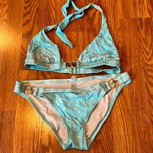 Victoria’s Secret mint and metallic halter bikini with metal accents.